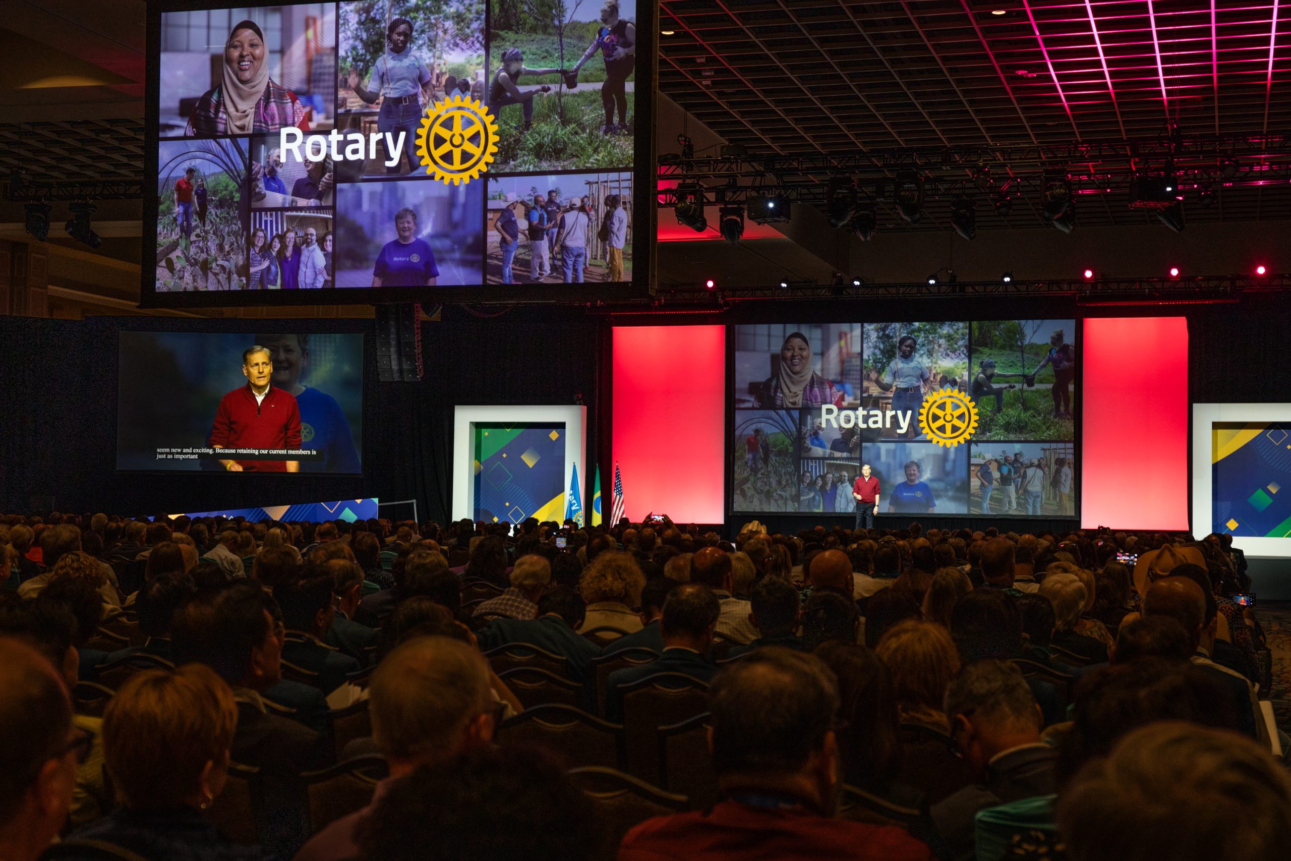 An Rotary event where a presenter is giving a presentation to the audience. 